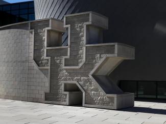 UK brick wall at the Gatton Student Center.