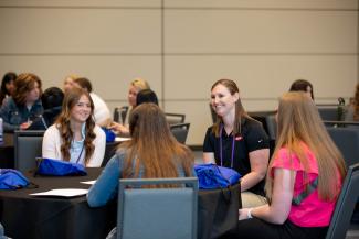 Women Engineers Sitting around a table 