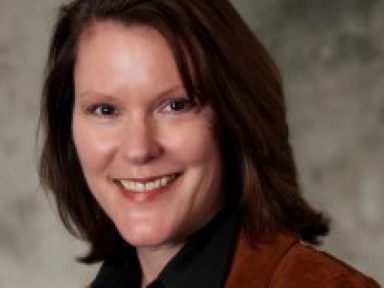 Joan E. Herbig.